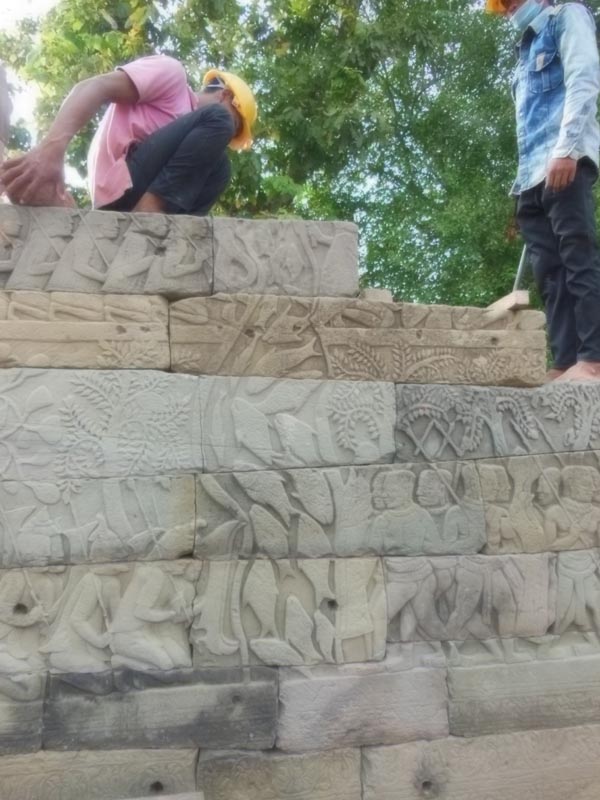 Bas Relief workers on wall